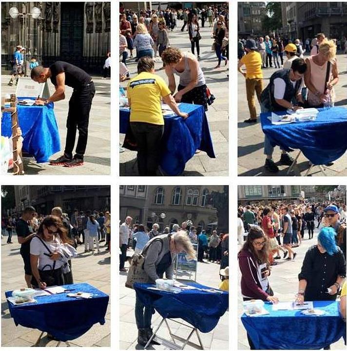  Prikupljanje potpisa na peticiju ispred katedrale u Kelnu.